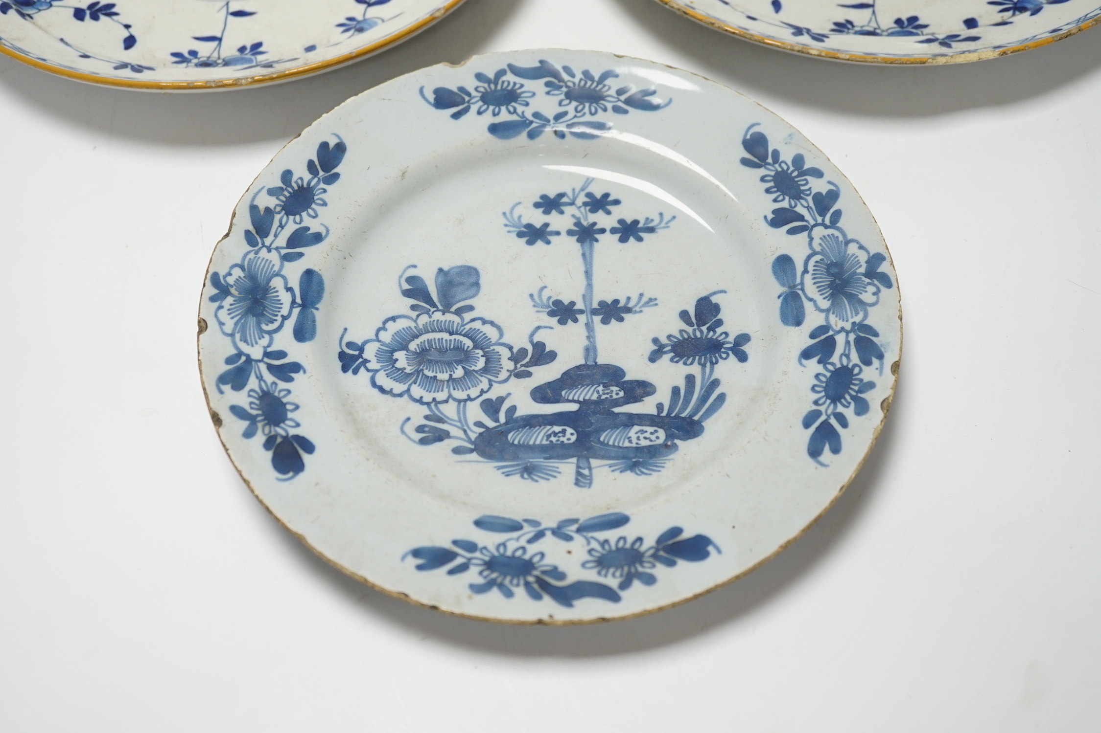 A pair of late 18th century Delft plates and an English delftware plate (3)